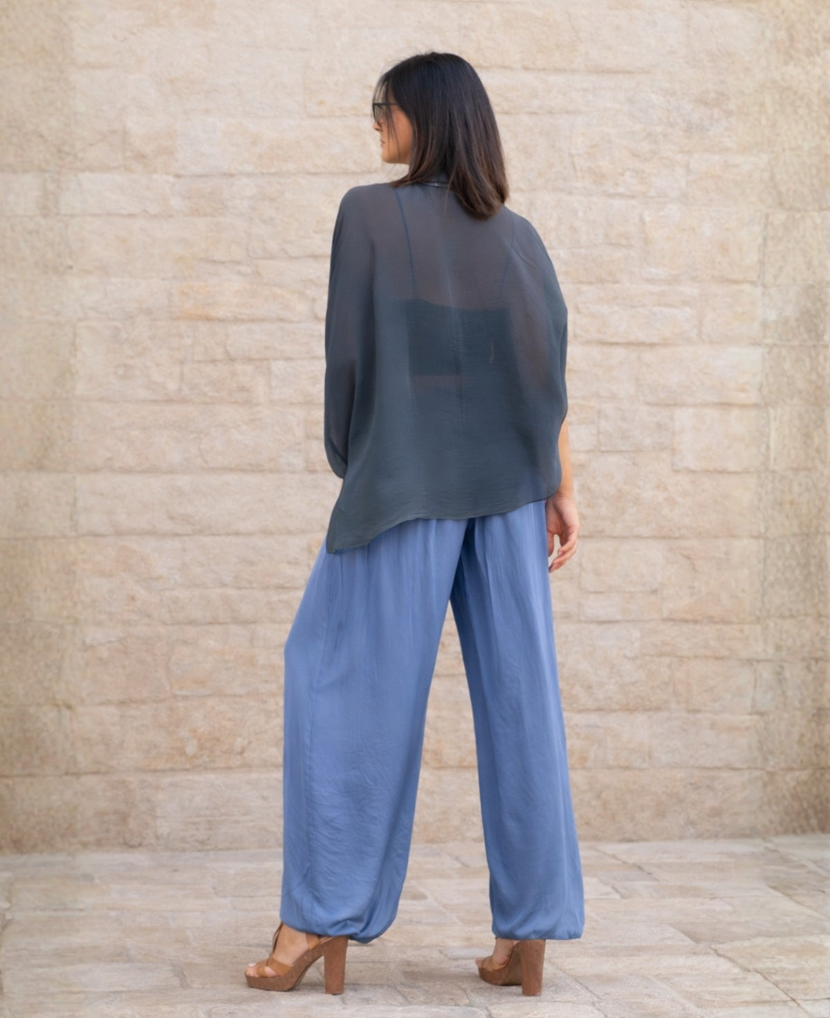 Back view of Petra silk blend balloon pants in Summer Jeans highlighting sheer silk blend overlay, generous fit and balloon-style hemline