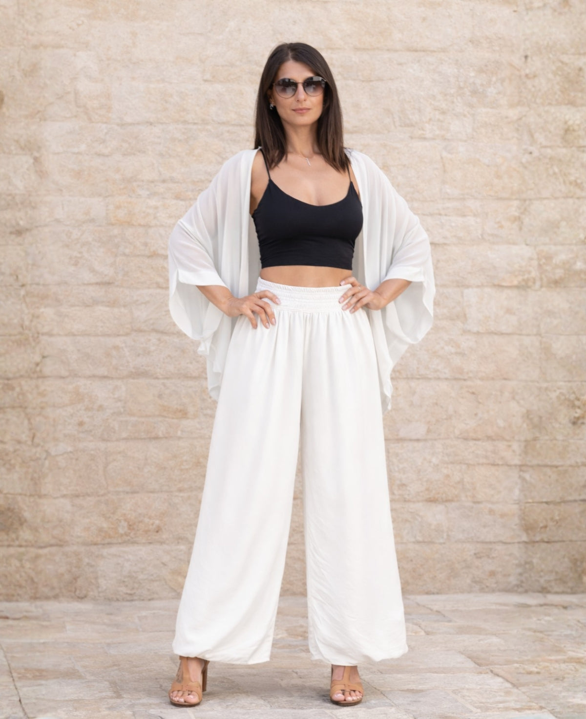 Front view of Petra silk blend balloon pants in white  featuring stretch jersey waistband, sheer overlay and fluid balloon silhouette