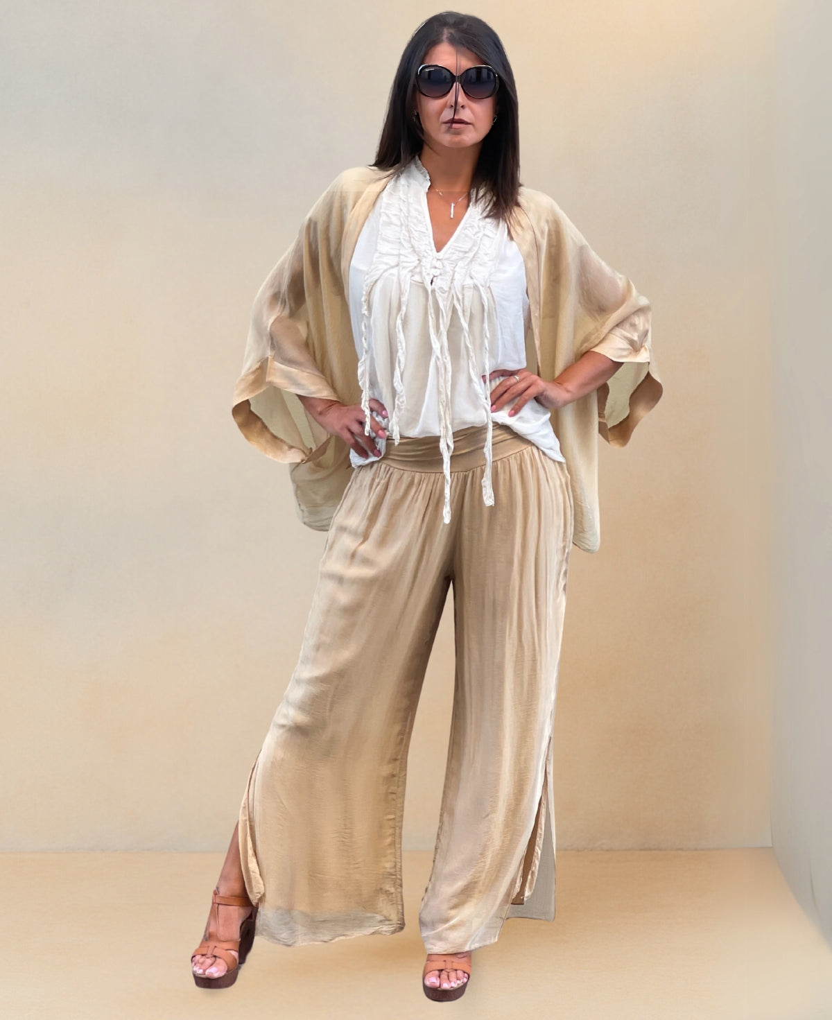 Full frontal view of Silk-Blend Pants in caramel colour highlighting calf-high slit and elegant draping