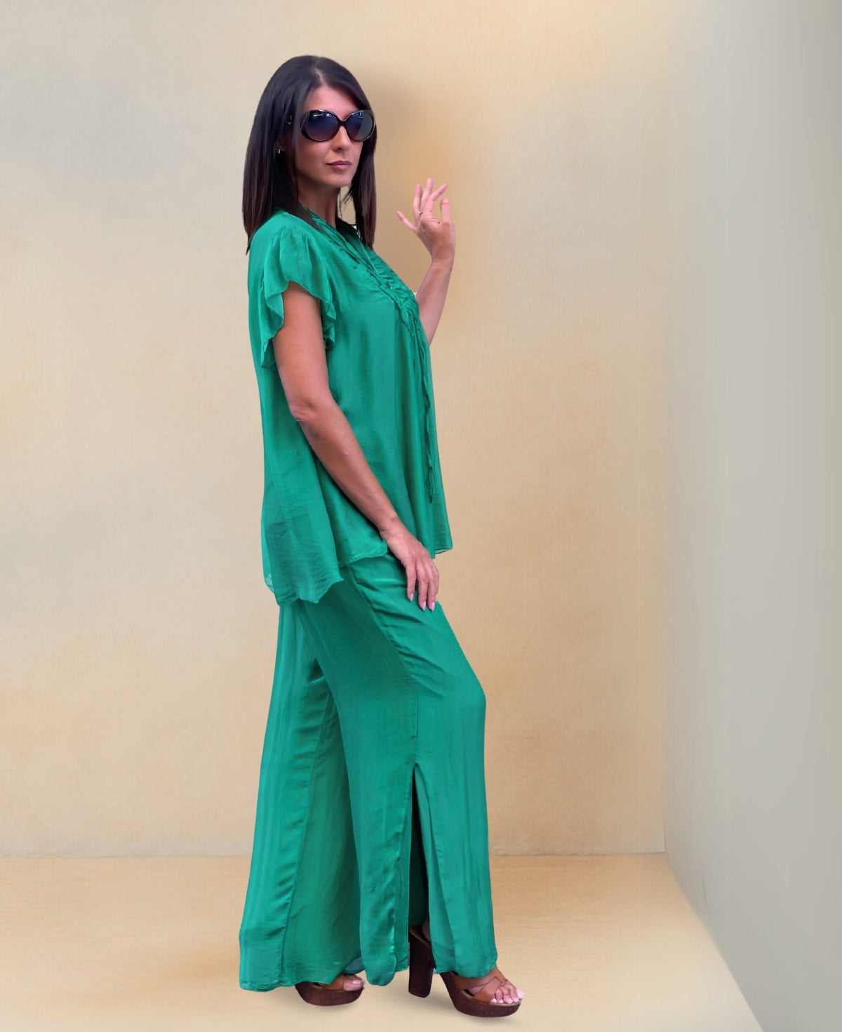 Side view of Silk-Blend Pants with comfortable waistband and playful calf-high slit