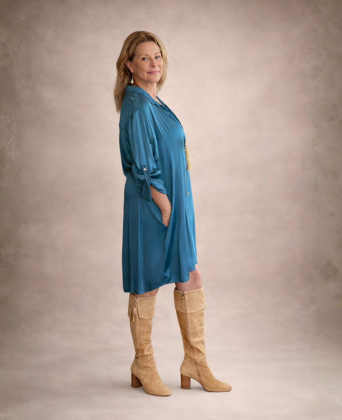 Angled view of the Porcha Satin Long Shirt-Dress in teal satin showing the fluid drape and relaxed fit.