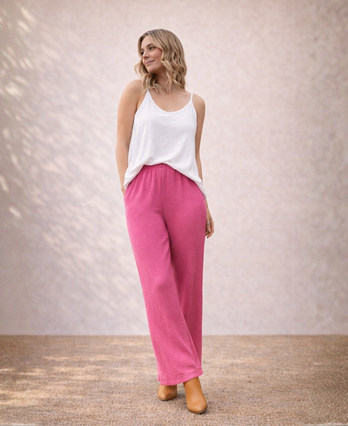 Punto Cotton Pants fuchsia colour variant with relaxed wide leg silhouette and soft breathable cotton fabric.