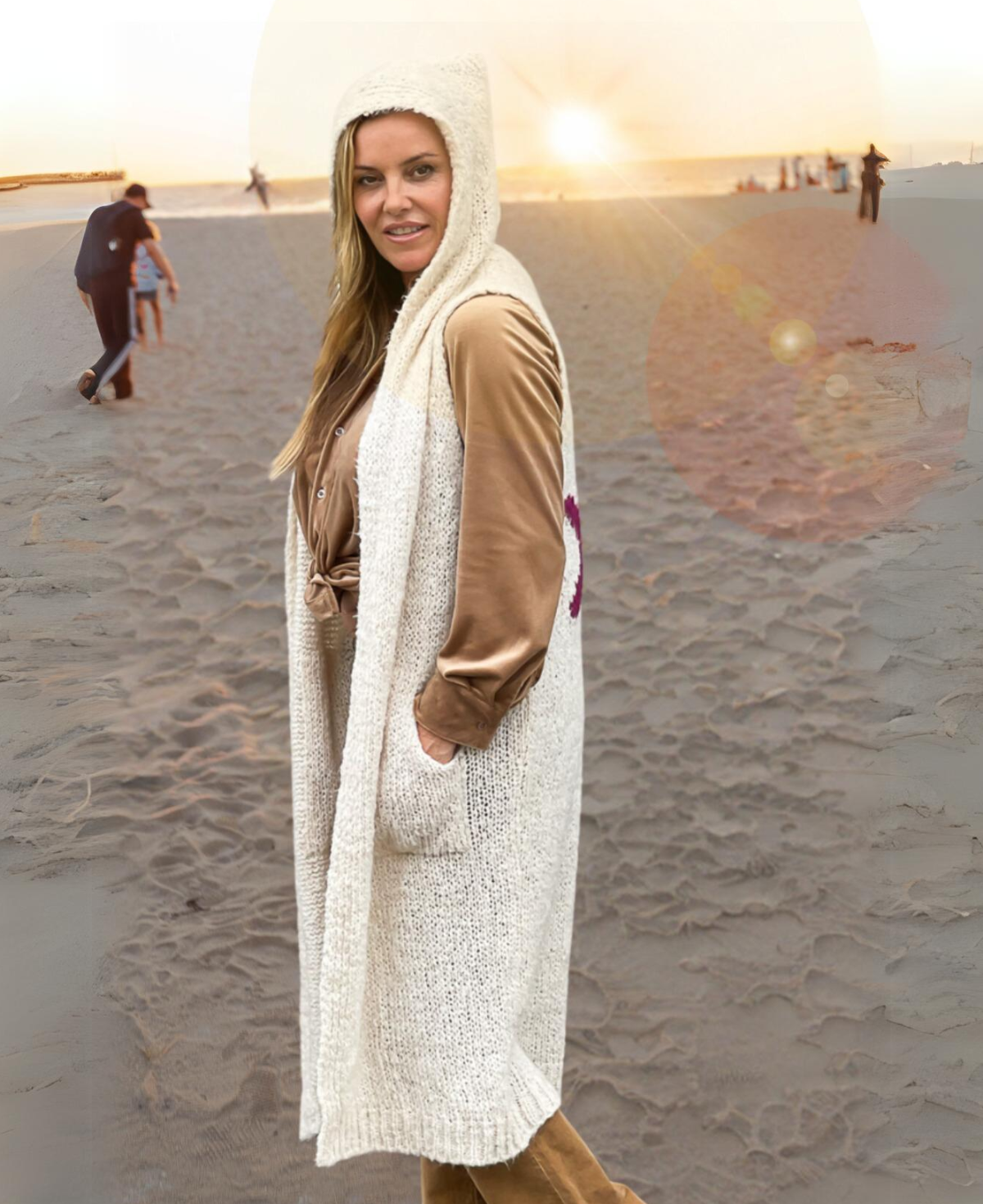 Side view of Cream Rockstar Jumper highlighting cozy, sleeveless cardigan silhouette
