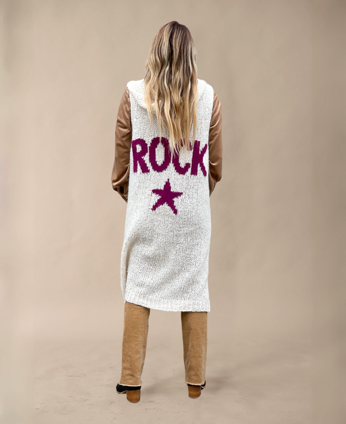 Back view of Cream Rockstar Jumper featuring "ROCK" graphic and woolly hood