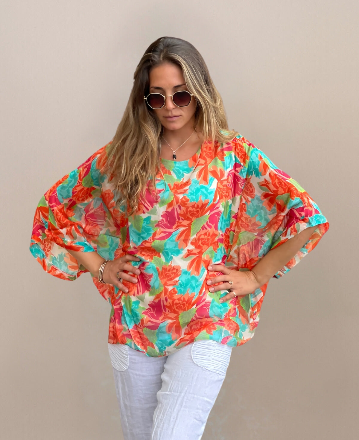 Close-up view of Roses Silk Top highlighting vibrant floral pattern and luxurious silk blend