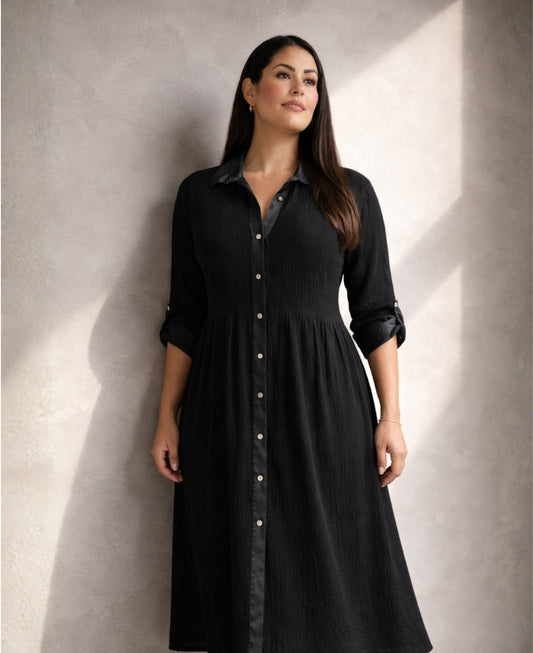 Black Roxberry Curvy Fit shirt dress in directional light highlighting satin collar, satin placket and vertical crinkle texture with sculpted silhouette.