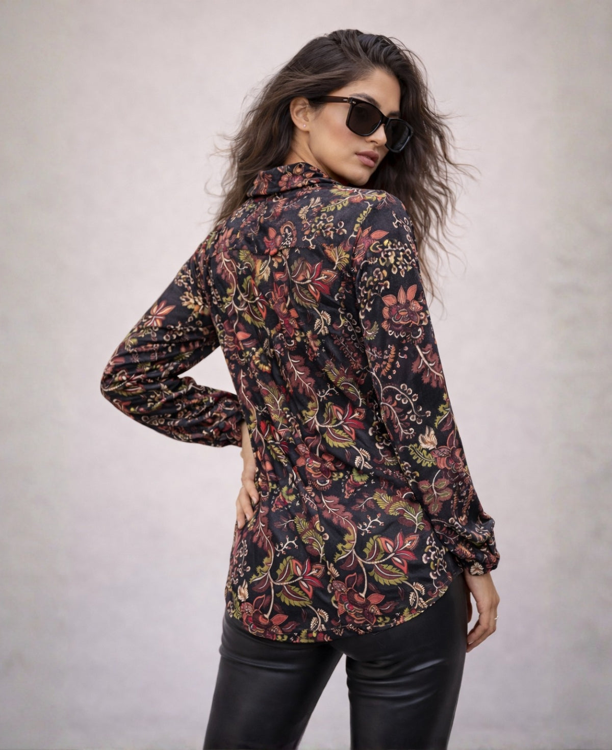 Angled back view of the Ruby Vintage Shirt showing length and relaxed fit, styled with black leather pants