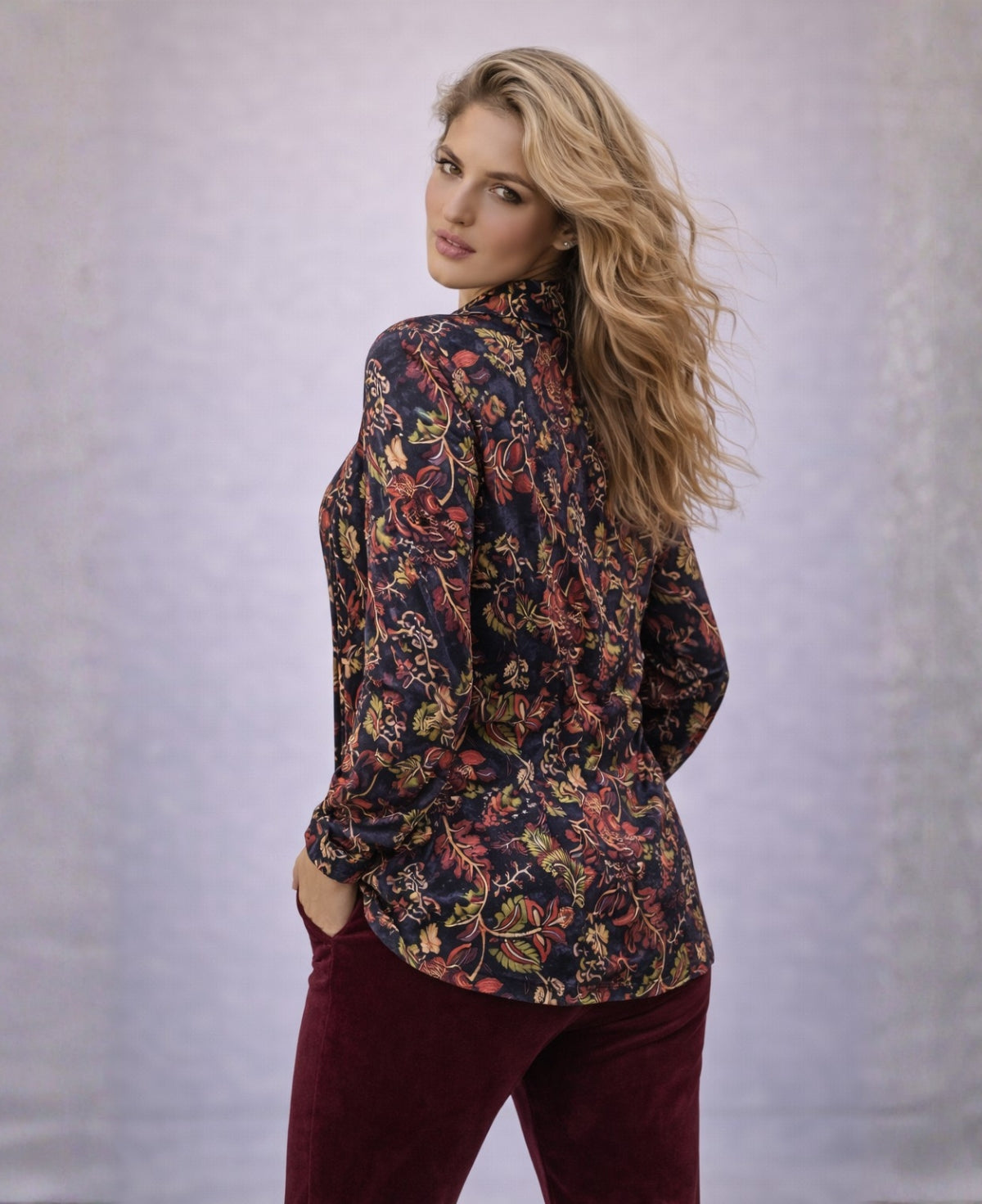 Back view of the Ruby Vintage Shirt worn loose, showing long length and vintage floral print