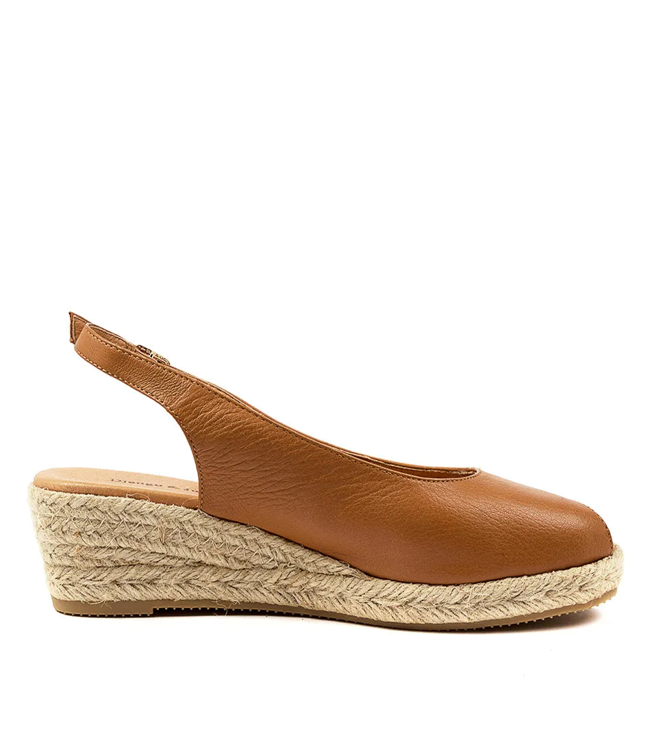  Close-up of the SANIARLY leather espadrille wedge sandal, showing intricate jute detailing and premium leather craftsmanship.
