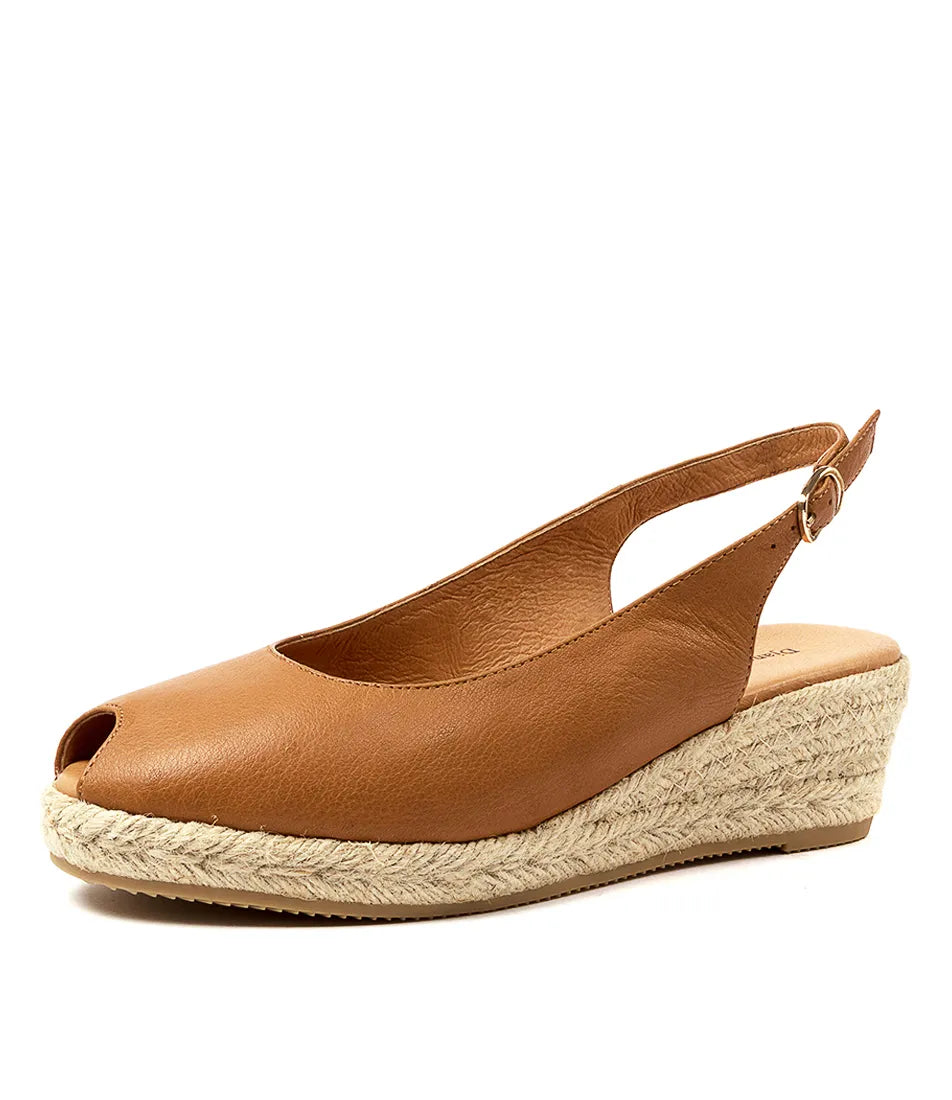  Angled view of the SANIARLY espadrille wedges, showcasing the peep-toe design, leather upper, and stylish jute wedge heel.
