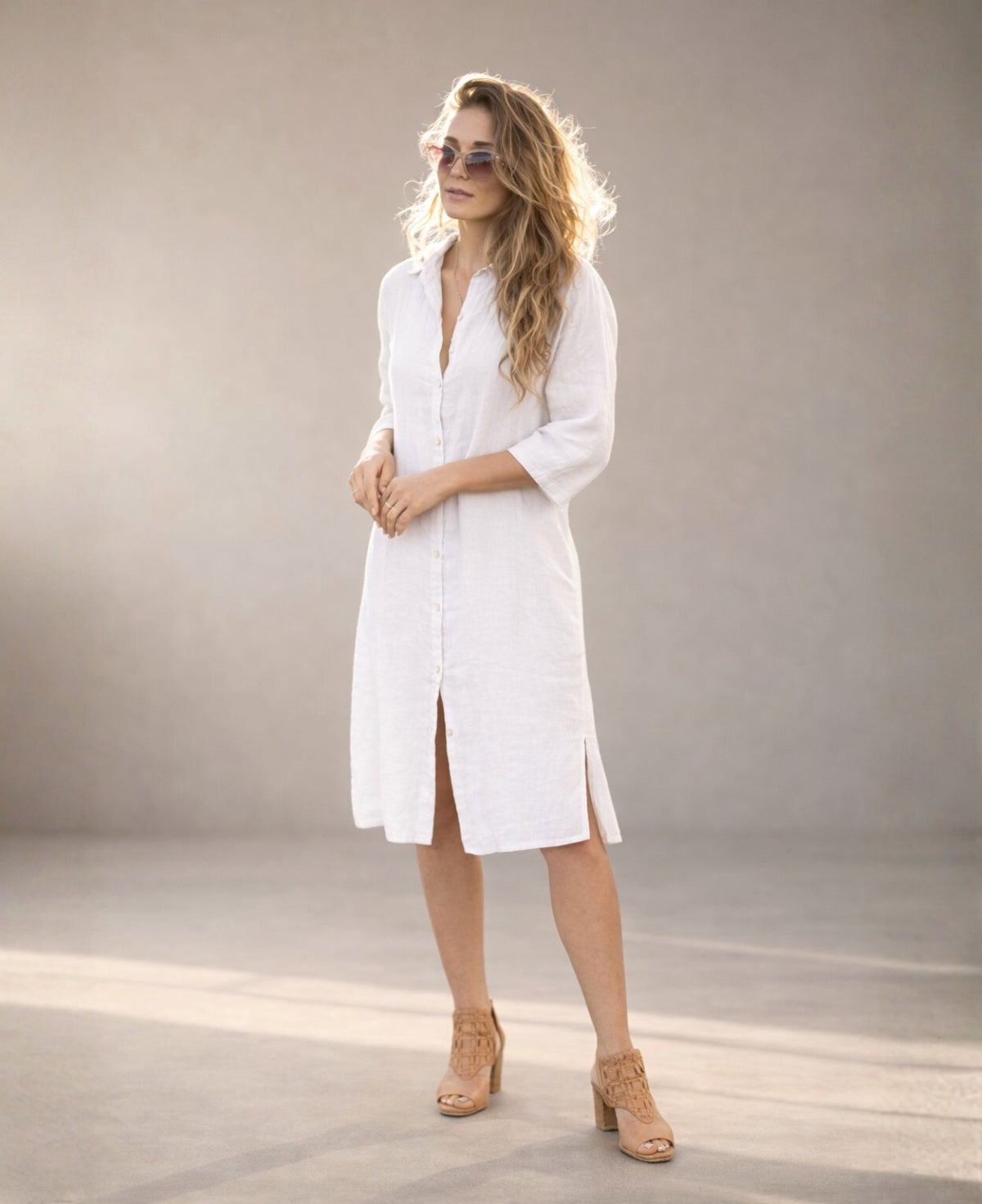 White Samira Linen Shirt-Dress worn buttoned as a standalone dress, front studio view highlighting clean silhouette and natural linen texture.