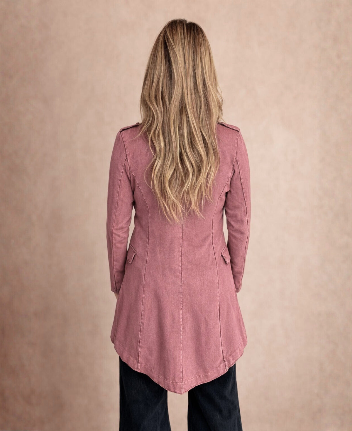 Back view of the Sergeant Pepper Jacket in wine showing the tailored seams and flared hem shape.
