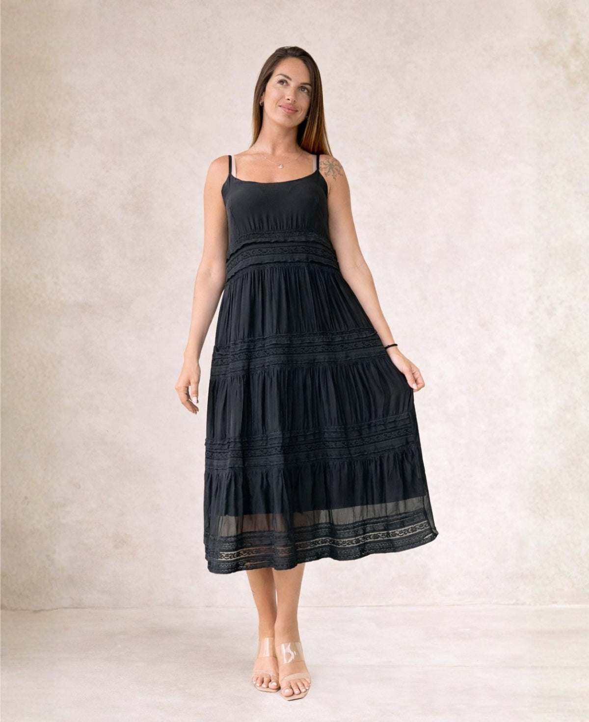 Black Shae silk blend midi dress showing flowing silhouette and lace tiers