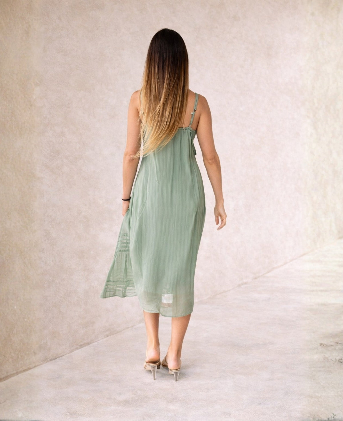Back view of sage green Shae silk blend midi dress with soft drape