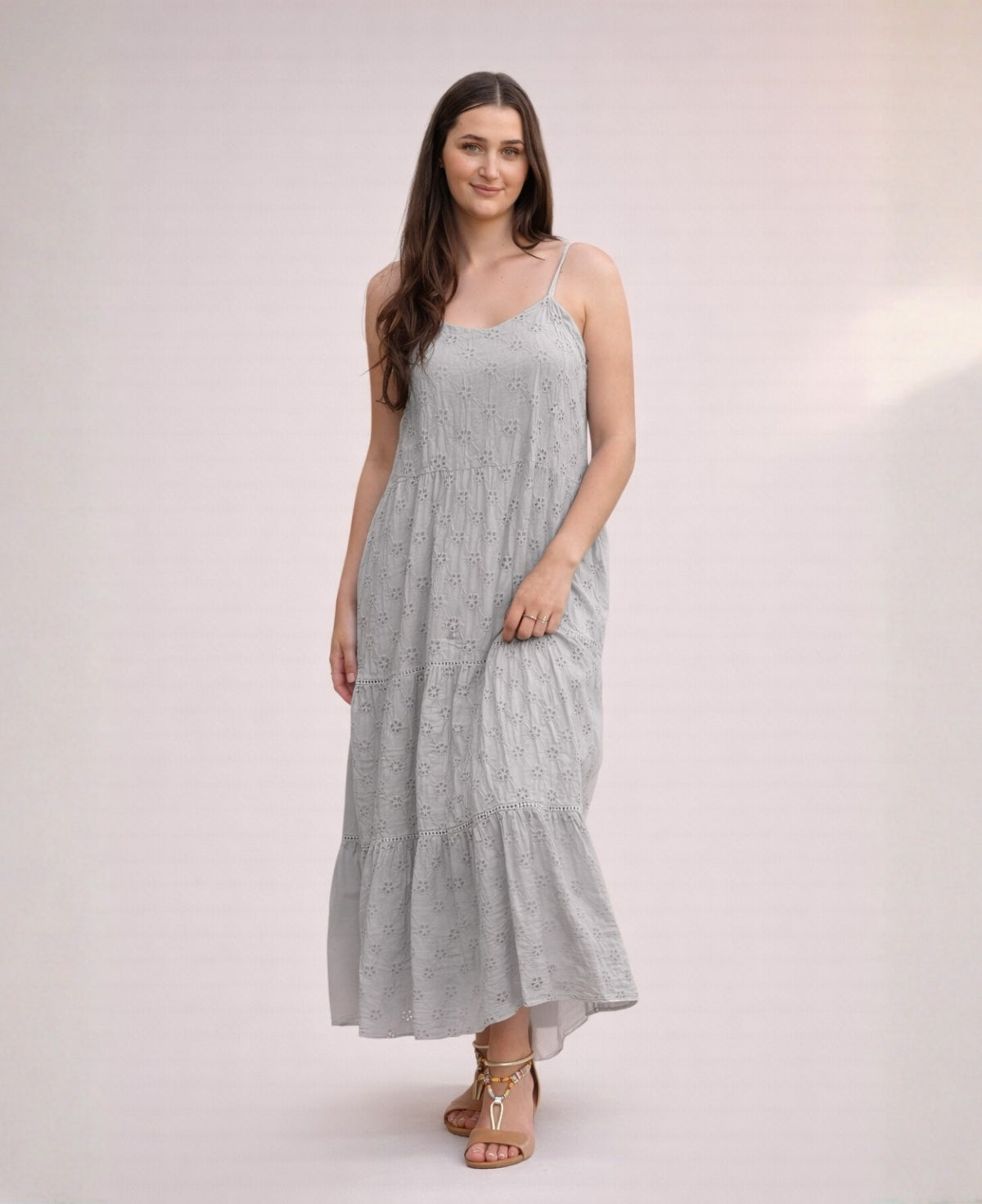 Front view of the Skylar Cotton Eyelet Dress in silver grey showing embroidered cotton fabric and flowing tiered design