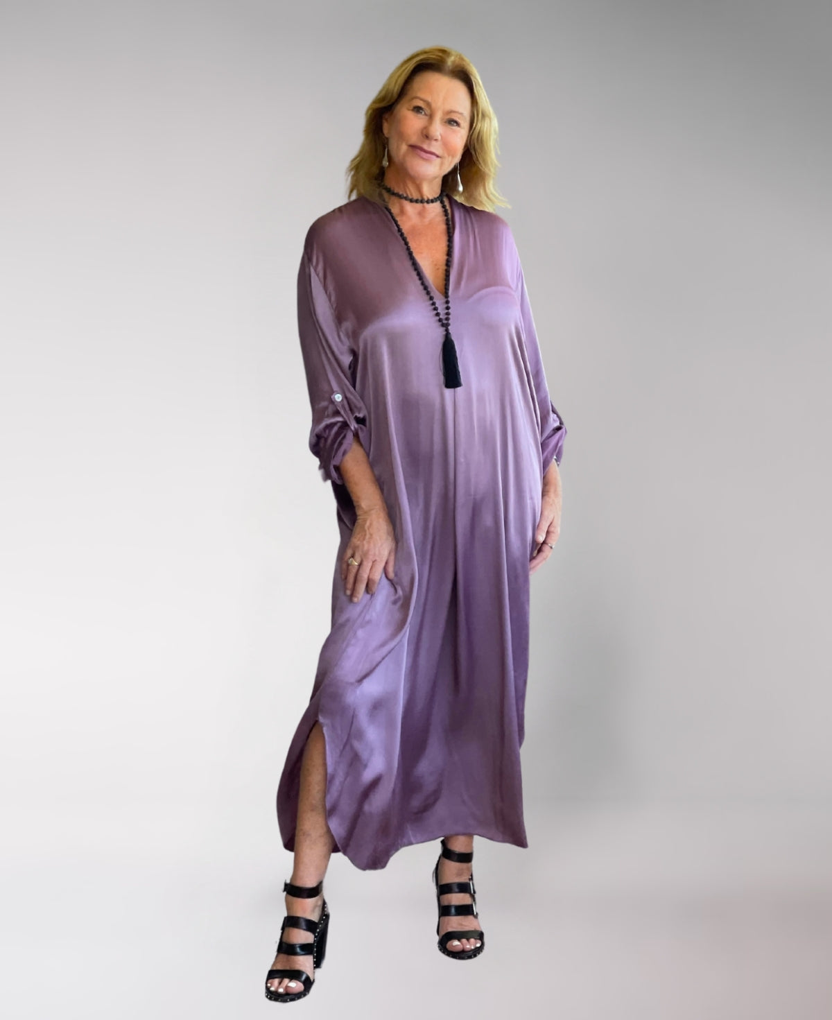 Valene Maxi Dress in dusty pink, crafted from luxurious satin with a soft sheen. Features a graceful V-neckline, flowing silhouette, and side splits for elegant movement.