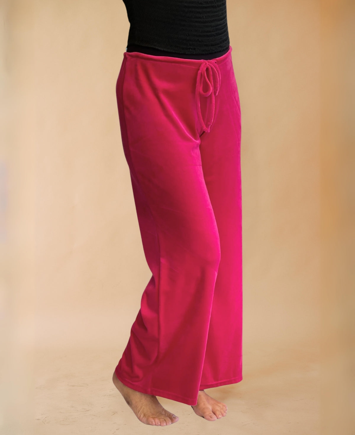 Hot pink Marshmallow Lounge Pants crafted from ultra-soft, lush chenille with a striking iridescent finish, combining cozy comfort with a vibrant, chic look for relaxing in style. 