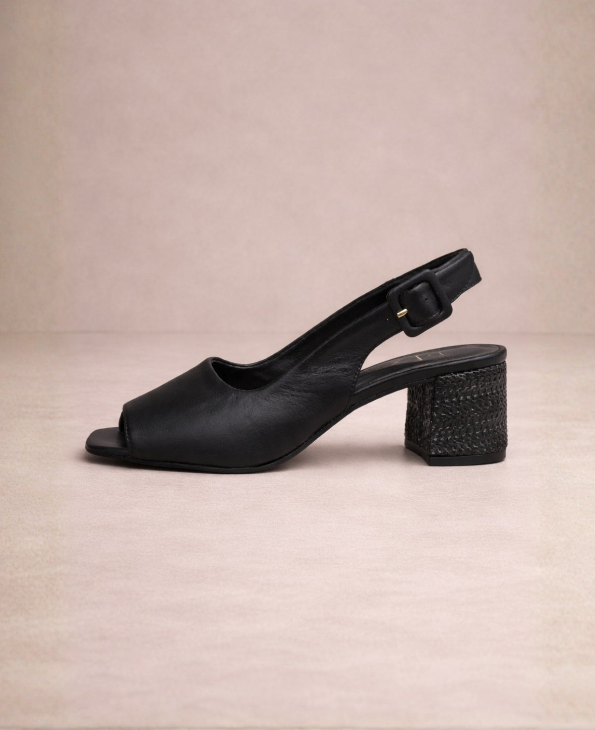 Black slingback block heel in smooth leather with mid-height textured heel, side profile view
