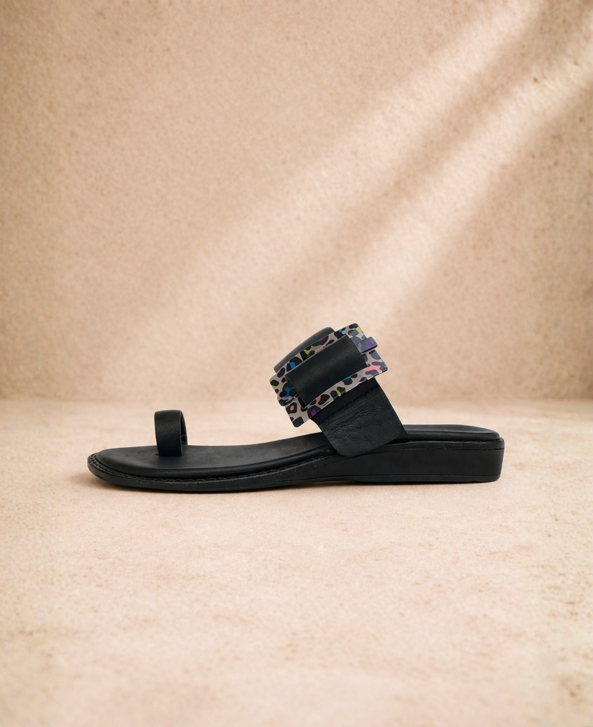 Side view of PIXY Shebah Slide Siyah Black sandal showing flat sole and structured leather upper
