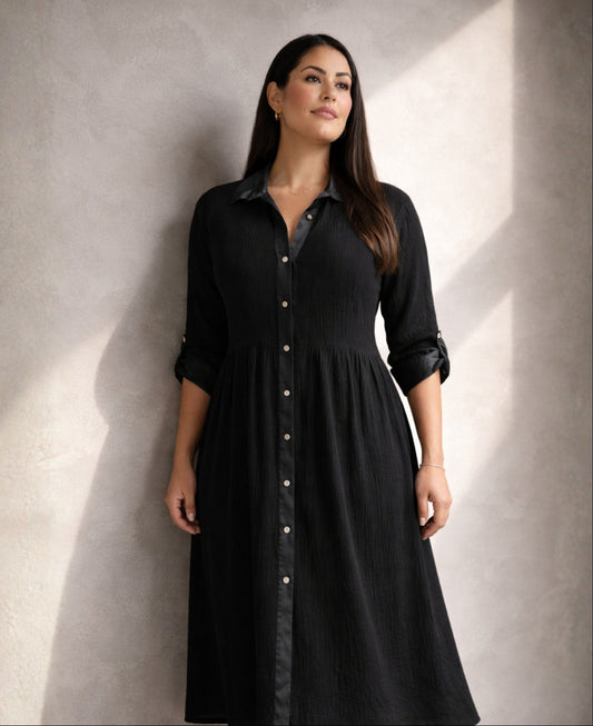 Black Roxberry Curvy Fit shirt dress in directional light highlighting satin collar, satin placket and vertical crinkle texture with sculpted silhouette.