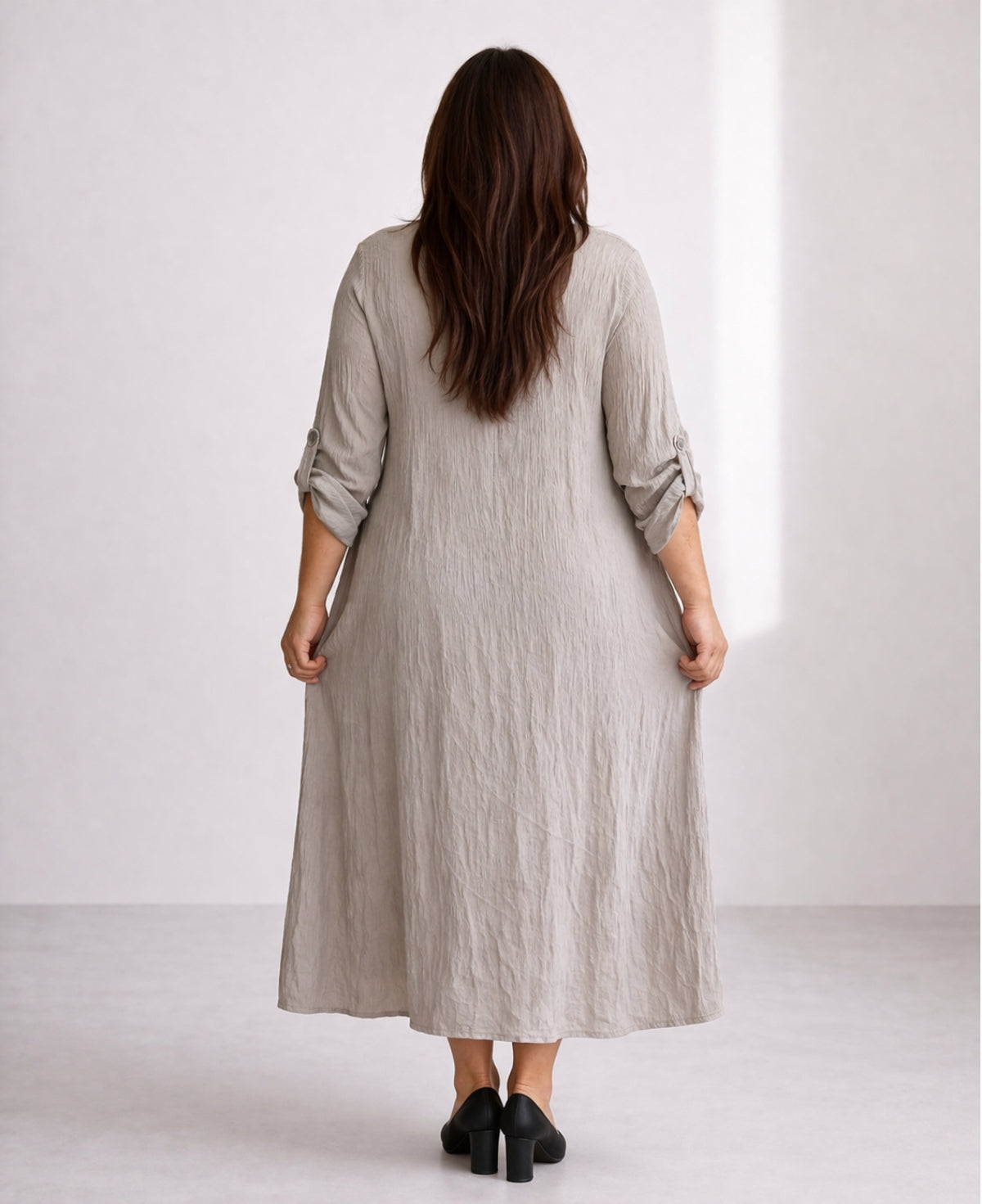 Back view of Roxberry Curvy Fit shirt dress in soft grey showing gathered skirt, mid calf length and vertical crinkle fabric on curvy fit silhouette