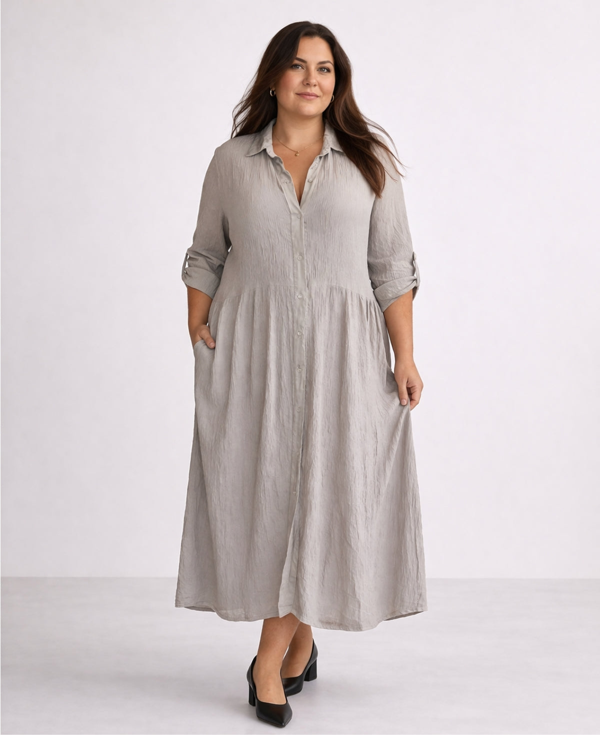 Curvy woman wearing Roxberry Curvy Fit shirt dress in soft grey with raised waist seam, gathered skirt and vertical crinkle texture front view