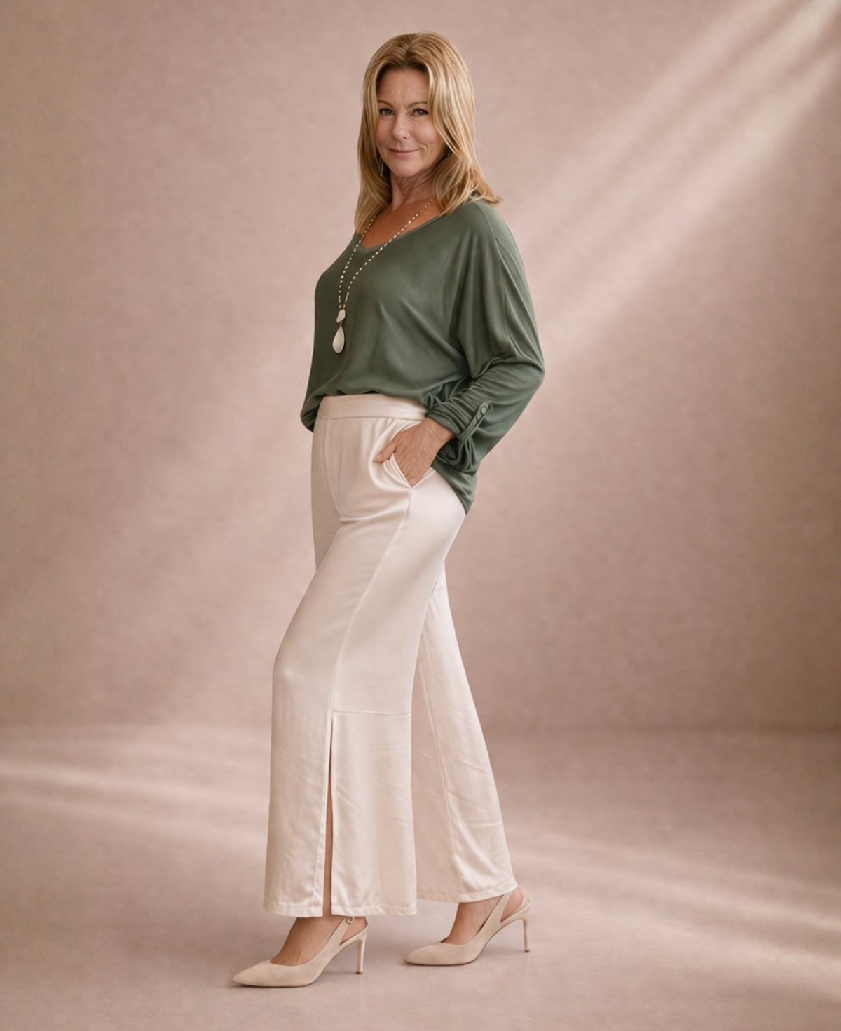 Oat satin wide leg pants styled with green top showing soft drape and relaxed fit